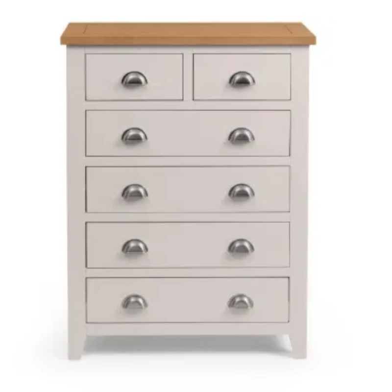White dresser with five drawers and a wooden top on a white background