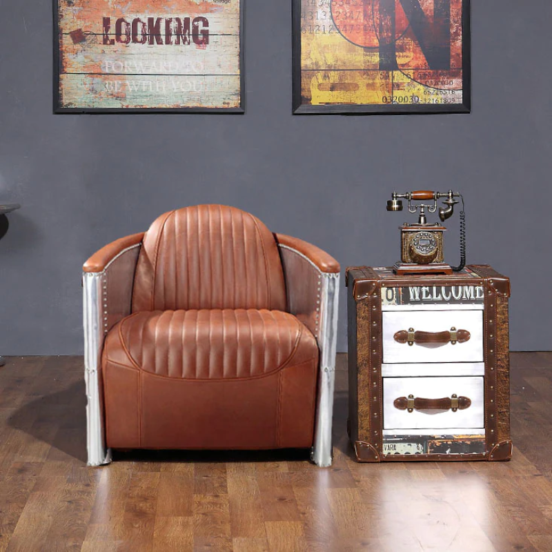 The Vintage Aviator Pilot Sofa Armchair in Black/Brown Real Leather is a stunning piece of furniture that exudes timeless elegance and captures the essence of classic aviation design. This armchair is a perfect blend of style and comfort, making it an ideal addition to any living space or office.