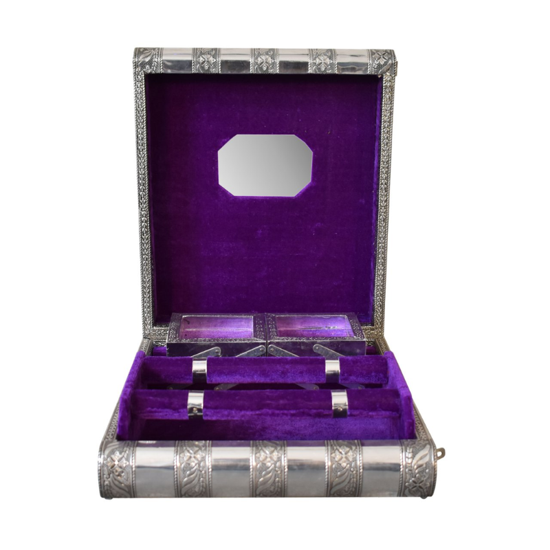 Decorative silver box with purple interior on a white background