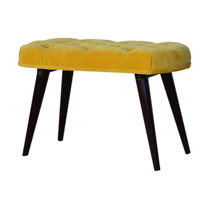 This Nordic style bench has been upholstered in a beautiful Mustard yellow cotton velvet fabric and features a classy deep-button design on the top.  The bench stands on 4 legs constructed from 100% solid mango wood in a walnut finish and it is the perfect piece to add to your bedroom or hallway as a finishing touch in the home.