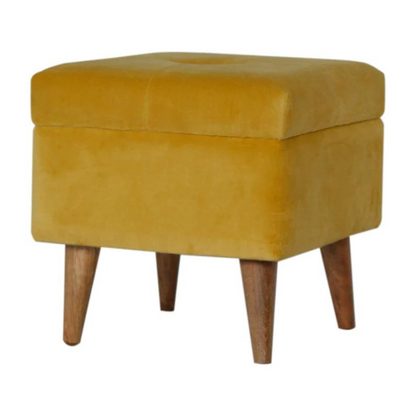 This little footstool is a elegant addition to the home. It has been upholstered in a mustard yellow cotton velvet fabric and has 4 solid wood nordic wood style legs in an oak-ish finish.  It is beautiful and versatile at the same time, it has an important feature which is the storage compartment that can be used to place things inside and save space in the home.