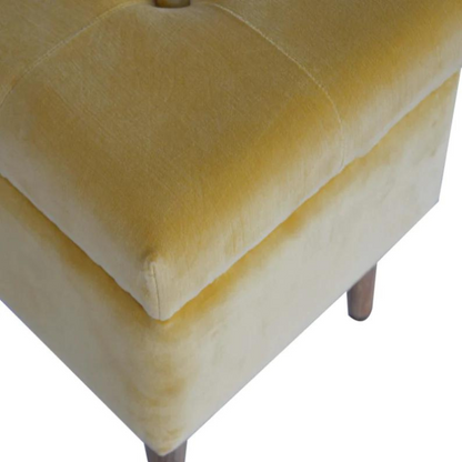 This little footstool is a elegant addition to the home. It has been upholstered in a mustard yellow cotton velvet fabric and has 4 solid wood nordic wood style legs in an oak-ish finish.  It is beautiful and versatile at the same time, it has an important feature which is the storage compartment that can be used to place things inside and save space in the home.