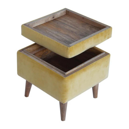 This little footstool is a elegant addition to the home. It has been upholstered in a mustard yellow cotton velvet fabric and has 4 solid wood nordic wood style legs in an oak-ish finish.  It is beautiful and versatile at the same time, it has an important feature which is the storage compartment that can be used to place things inside and save space in the home.