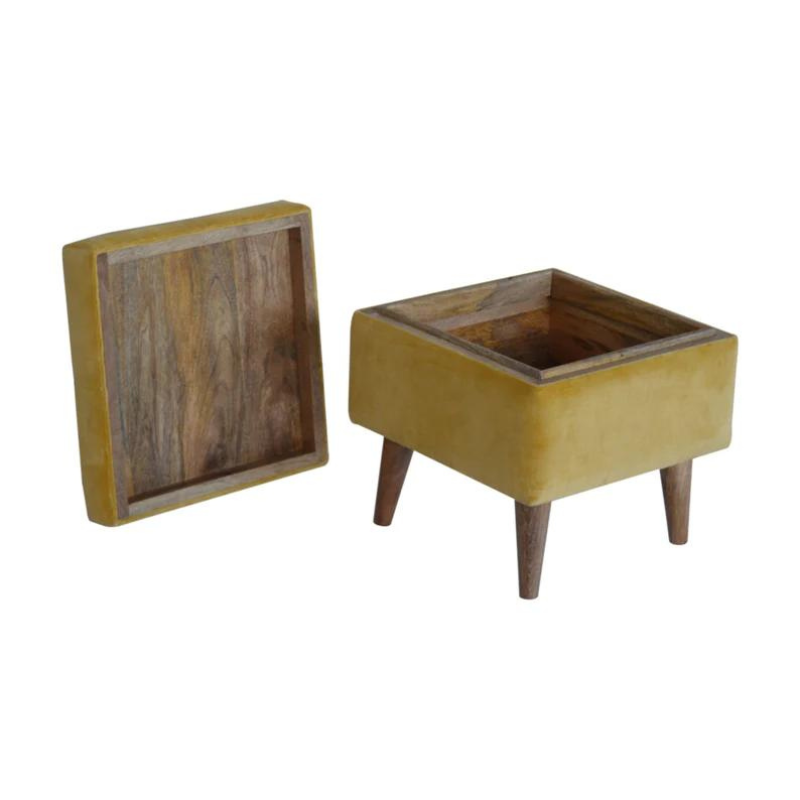 This little footstool is a elegant addition to the home. It has been upholstered in a mustard yellow cotton velvet fabric and has 4 solid wood nordic wood style legs in an oak-ish finish.  It is beautiful and versatile at the same time, it has an important feature which is the storage compartment that can be used to place things inside and save space in the home.