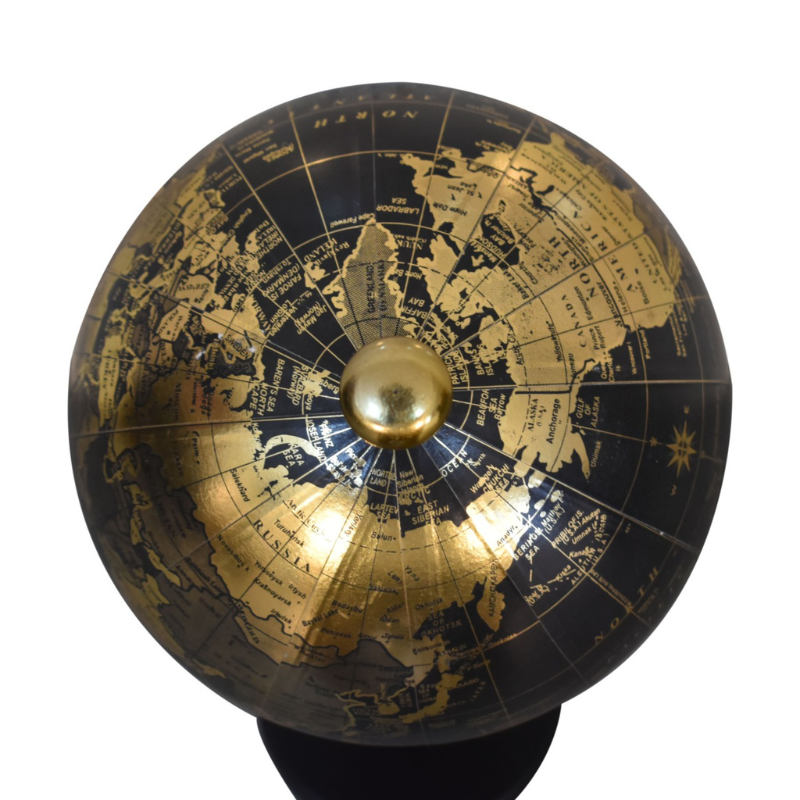 The globe is handcrafted and boasts a mixed brass and black glossy finish. The spherical globe features loose engravings, depicting the world map. The relaxed nature and style of the colours create a striking contrast between the black and brass finishes. This product is handcrafted individually and as every piece is unique please do expect variations in finish, texture, size and should not be considered as a defect.