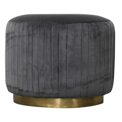 This beautiful and fashionable footstool will make the perfect addition to any bedroom or living room. It has been upholstered in a luxurious grey cotton velvet fabric with a pleated design featuring a gold brass base. Perfect for putting your feet up, using as a handbag stand, or as an accent piece in the home.