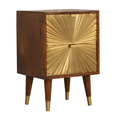 This Manila Gold Chestnut Bedside Table was designed to add a touch of elegance and charm to your bedroom. Featuring brass-plated drawers and Nordic-style brass cap feet, this piece has been constructed from 100% solid mango wood and offers a rich chestnut finish along with pull-out handles and surface space to uplift your whole bedroom look.