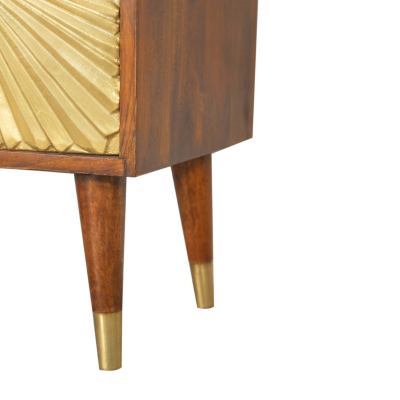 This Manila Gold Chestnut Bedside Table was designed to add a touch of elegance and charm to your bedroom. Featuring brass-plated drawers and Nordic-style brass cap feet, this piece has been constructed from 100% solid mango wood and offers a rich chestnut finish along with pull-out handles and surface space to uplift your whole bedroom look.