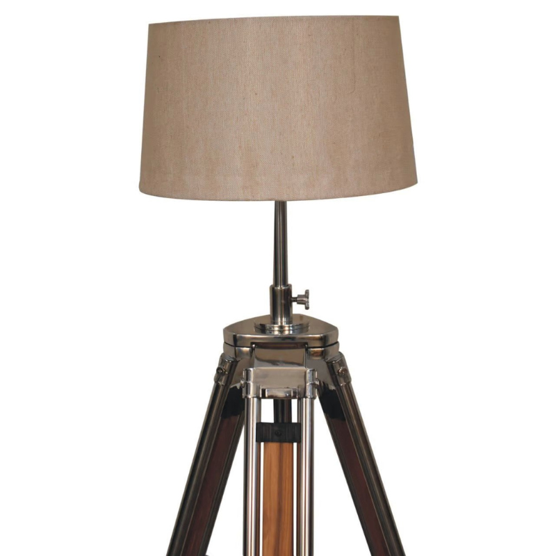 This contemporary lamp features a mixed wooden and chrome tripod design base as well as a neutral lampshade which will provide stability as well as a natural colourway and soft contrast.   It is bound to inject both a modern and rustic touch to your home décor. It also has an adjustable base so you can change the height depending on your preference.