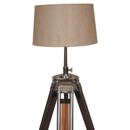 This contemporary lamp features a mixed wooden and chrome tripod design base as well as a neutral lampshade which will provide stability as well as a natural colourway and soft contrast.   It is bound to inject both a modern and rustic touch to your home décor. It also has an adjustable base so you can change the height depending on your preference.