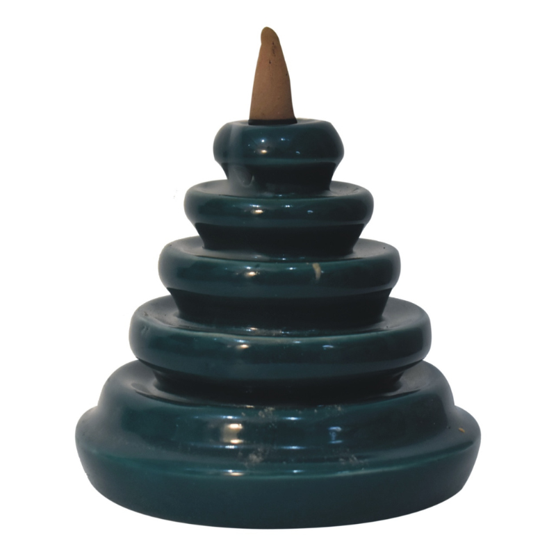 The backflow fountain burner set is exquisitely crafted and features a unique teal waterfall design, ideal as a gift for friends and family. The set includes a backflow burner, incense holder, fragrant backflow cones in Rose, Lavender, Jasmine and Pineapple and fragrant inscense sticks in Amber, Lavender, Oudh and Woods.