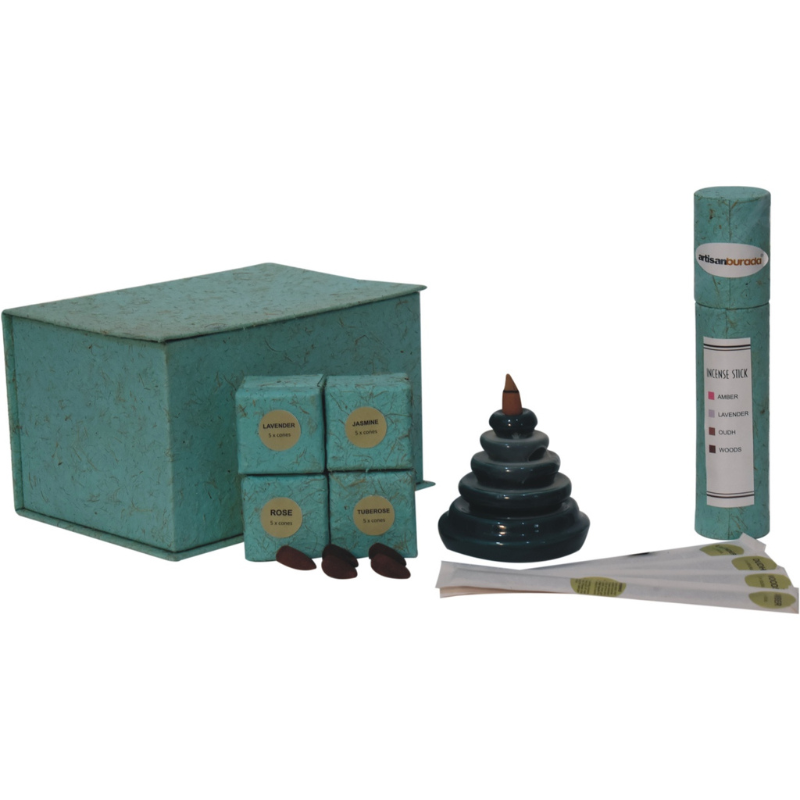 The backflow fountain burner set is exquisitely crafted and features a unique teal waterfall design, ideal as a gift for friends and family. The set includes a backflow burner, incense holder, fragrant backflow cones in Rose, Lavender, Jasmine and Pineapple and fragrant inscense sticks in Amber, Lavender, Oudh and Woods.