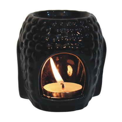 The Black Buddha Oil Burner Set is a beautiful and functional addition to any home. The intricately designed black Buddha head serves as a stylish and elegant way to enjoy the benefits of aromatherapy. The set comes complete with three delightful aroma oils in Ylang Ylang, White Lotus, and Lavender, which are known for their calming and soothing properties.