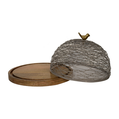 This cake stand is a beautiful decoration for your dining table or kitchen counter. It features a round wooden base and a blue netted top that has a brass bird handle allowing your entire space to feel fresh, on-trend, and refined.