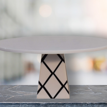 Update your home decor with this cake stand which will make a wonderful centrepiece thanks to its beautiful cross pattern design and spacious flat top.  It can be used to display muffins, cakes, and scones or as a charcuterie board in the kitchen, or be gifted to a friend or family member on a special occasion.