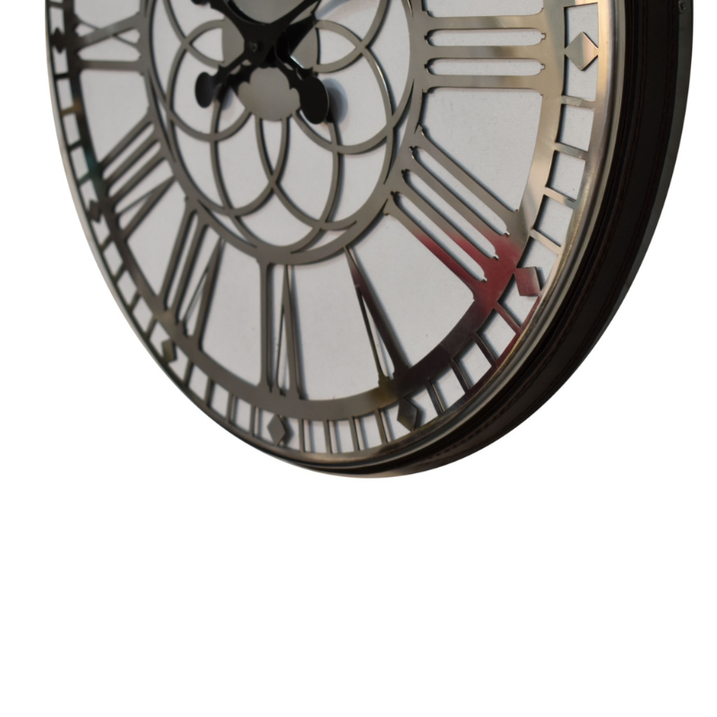 This striking clock is the perfect blend of modern and traditional design. It features a silver chrome frame that includes large roman numerals for a dramatic effect, whilst the mirrored background is ideal for reflecting the light and catching your eye.