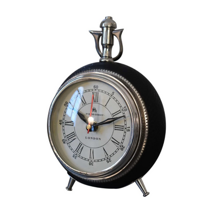 This handsome alarm clock is inspired by Art Deco design with its large numerals, metal bezel and matching hands, and housed in a convex glass lens. Display this piece beautifully on your bedside.