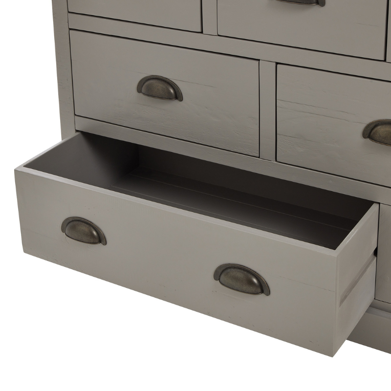 The Oxley Collection Nine Drawer Chest is perfect for display as well as storage. A washed wood plank surface blended with a frame in a warm grey hue deliver a relaxed, informal feel to any space. Stylish as well as functional, this high quality item would be equally at home in traditional and contemporary styled spaces. Style with a couple of lamps to really highlight its beauty.