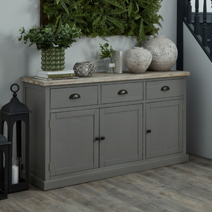 The Oxley Collection Sideboard is perfect for display as well as storage. A washed wood plank surface blended with a body in a warm grey hue deliver a relaxed, informal feel to any space. Stylish as well as functional, this high quality item would be equally at home in traditional and contemporary styled spaces. Style with a couple of lamps to really highlight its beauty.