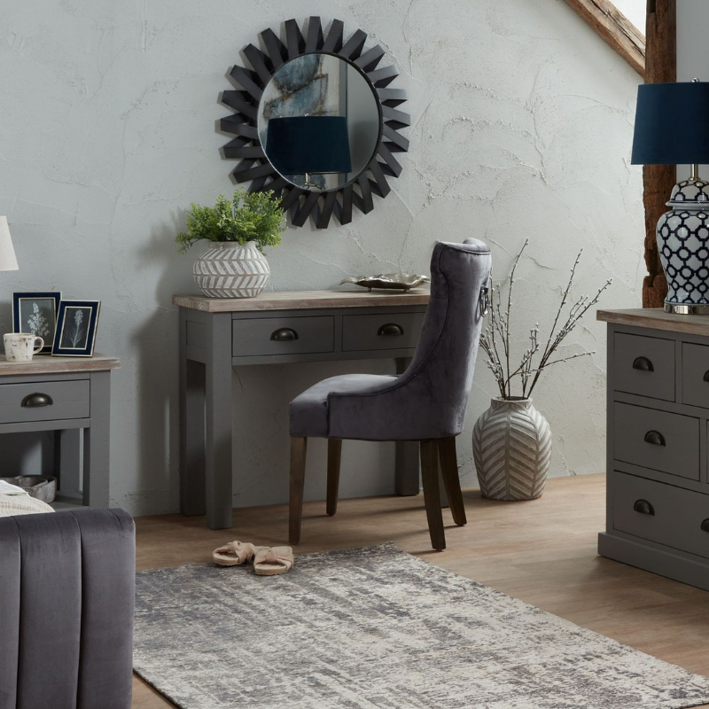 The Oxley Collection Two Drawer Console Table is perfect for display as well as storage. A washed wood plank surface blended with a body in a warm grey hue deliver a relaxed, informal feel to any space. Stylish as well as functional, this high quality item would be equally at home in traditional and contemporary styled spaces. Style with a large mirror or art piece above to really highlight its beauty. Perfect for a hallway but could also be put to use in the bedroom as a dressing table.