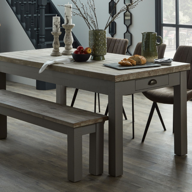 The Oxley Collection Dining Table boasts two drawers, perfect for keeping its surface clutter free whilst ensuring dining essentials remain close to hand. A washed wood plank surface blended with a frame in a warm grey hue deliver a relaxed, informal feel to dining spaces. Stylish as well as functional, this dining table would be equally at home in traditional and contemporary styled dining areas.