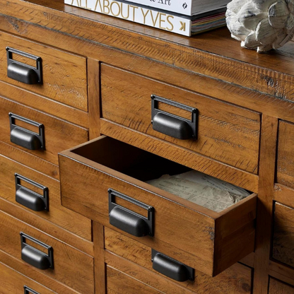 The combination of raw and organic textures of a solid pine body and cast iron accents has been used in the Draftsman Collection. This is the Draftsman Collection 20 Drawer Merchant Chest which is 90cm high, 160cm wide and 45cm deep with 20 drawers making it a great storage addition to any interior whilst being timelessly handsome too.