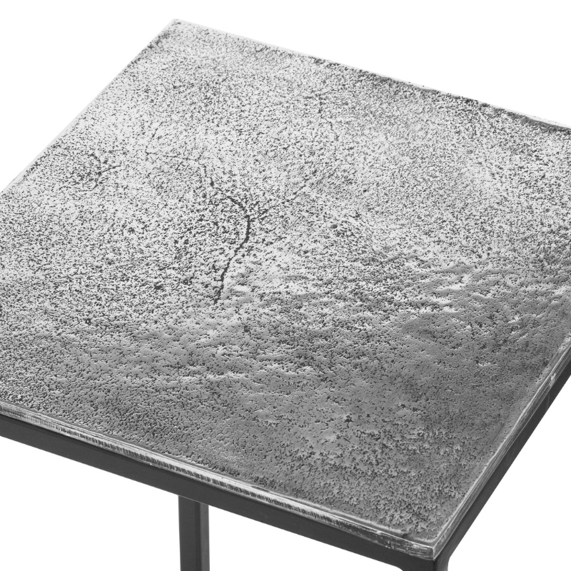 he Designer Collection Silver Nest of Three Tables from the Farrah Collection is an exquisite addition to any contemporary home. Crafted by hand using aluminium, these tables boast a unique, textured surface that is both visually striking and durable.