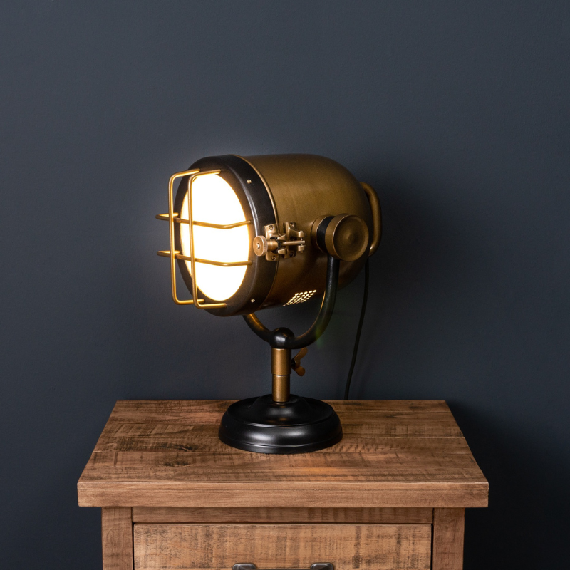 This is the Black and Brass Industrial Spotlight Table Lamp, with a bold industrial look this table lamp is sure to be a show stopper in any interior and will add an individual look to a lighting collection.  Influence has been taken from an old fashioned spotlight and has been completed with a sturdy base plus a black and brass finish to fit in with the industrial feel. Sure to make a handsome statement, this table lamp is a must have.  E27 Screw Bulb