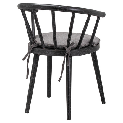 This is the Nordic Collection Dining Chair. Built from hard-wearing mango wood, this scandi-inspired chair's curved back and hand painted soft black painted finish lend an easy-going minimalism to its aesthetic. A perfect option for those looking for elegant simplicity and timeless style.