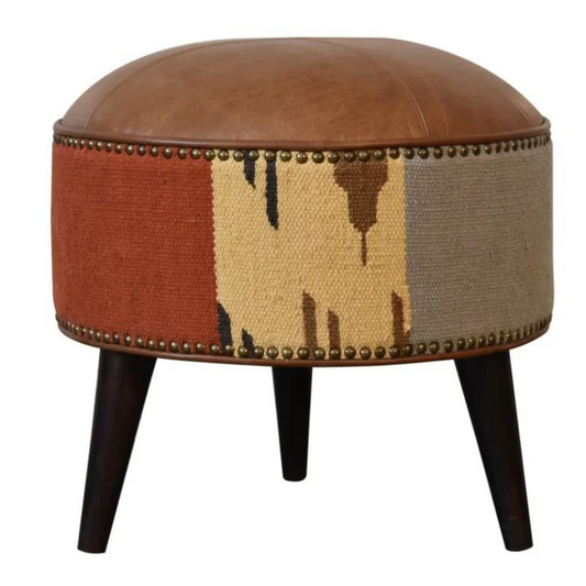 Introduce a playful piece to your interiors with this mixed footstool.  Combining both buffalo leather and durrie prints, it has nordic style legs in a dark walnut finish and it is the perfect piece to use in the living room with its compact size, making it ideal for extra seating for guests or as a footrest.