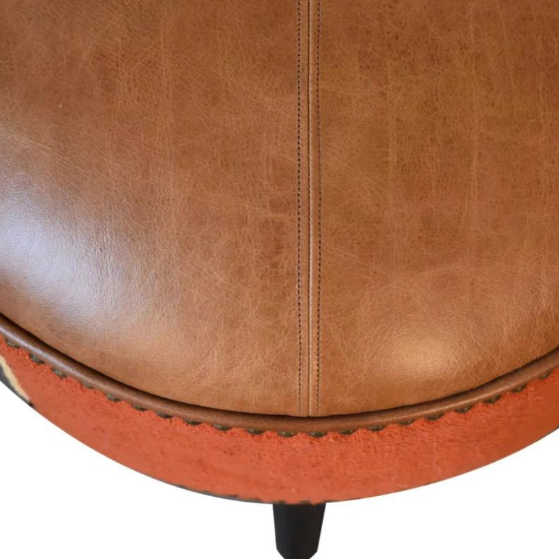 Introduce a playful piece to your interiors with this mixed footstool.  Combining both buffalo leather and durrie prints, it has nordic style legs in a dark walnut finish and it is the perfect piece to use in the living room with its compact size, making it ideal for extra seating for guests or as a footrest.
