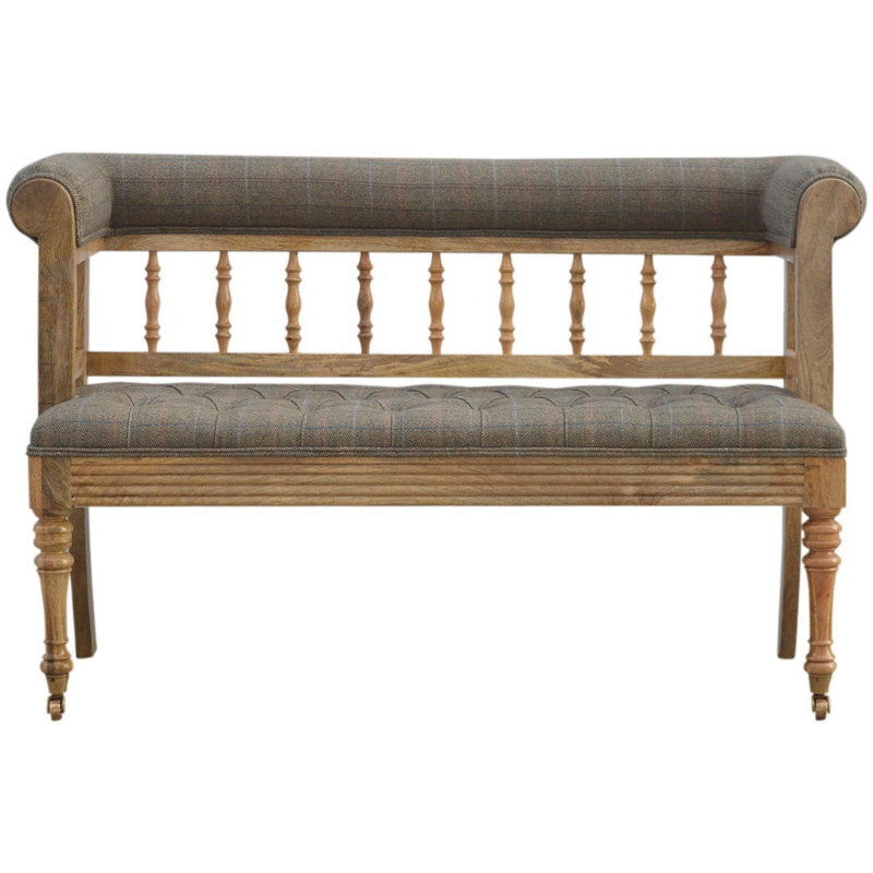 Add some luxury style to your home living area with this fabulous country tweed hallway bench. It is constructed from 100% solid mango wood in a oak-ish finish and upholstered in 100% multi tweed.  Other features include antique studs, detailed hand carved and hand turned front legs with casters and an overall oak-ish finish.