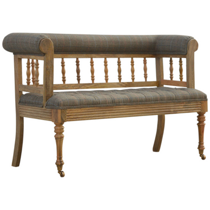 Add some luxury style to your home living area with this fabulous country tweed hallway bench. It is constructed from 100% solid mango wood in a oak-ish finish and upholstered in 100% multi tweed.  Other features include antique studs, detailed hand carved and hand turned front legs with casters and an overall oak-ish finish.