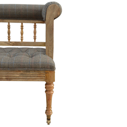 Add some luxury style to your home living area with this fabulous country tweed hallway bench. It is constructed from 100% solid mango wood in a oak-ish finish and upholstered in 100% multi tweed.  Other features include antique studs, detailed hand carved and hand turned front legs with casters and an overall oak-ish finish.