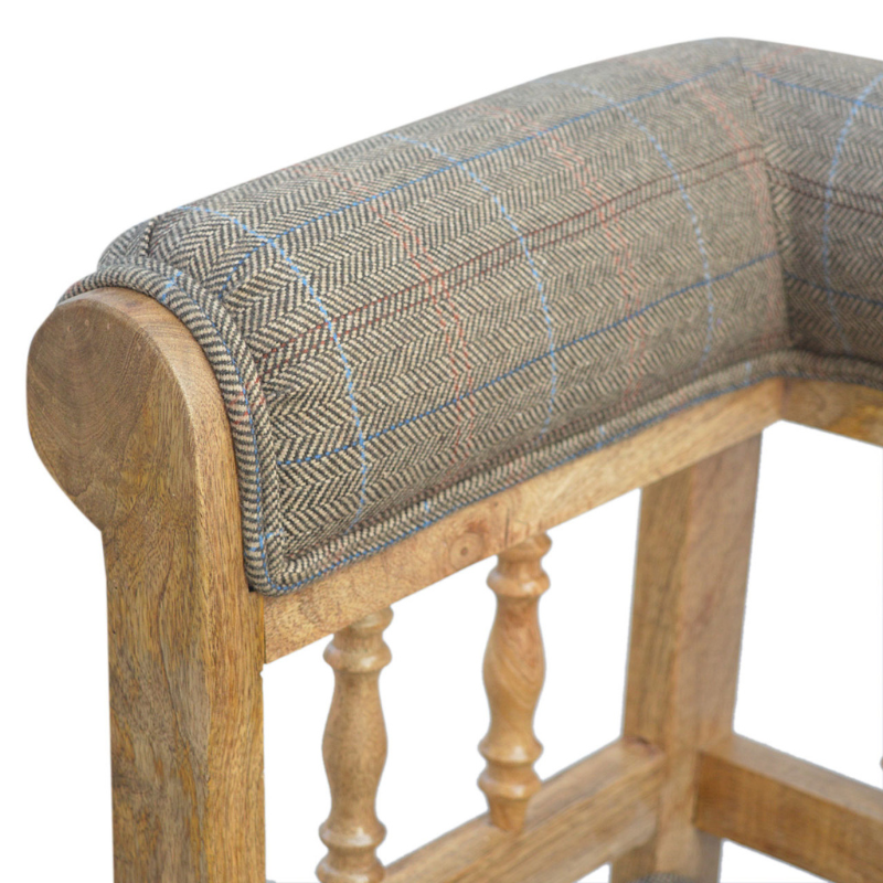 Add some luxury style to your home living area with this fabulous country tweed hallway bench. It is constructed from 100% solid mango wood in a oak-ish finish and upholstered in 100% multi tweed.  Other features include antique studs, detailed hand carved and hand turned front legs with casters and an overall oak-ish finish.