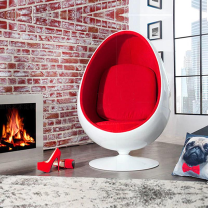 The Egg Pod Chair-Red Interior is a high-quality, retro-style chair that offers comfort and intimacy. Made of durable fiber glass material, it has a unique and unconventional design that has remained fashionable for decades. The chair features a swivel stand and a contoured seat upholstered with velvet or leather for a cozy atmosphere.