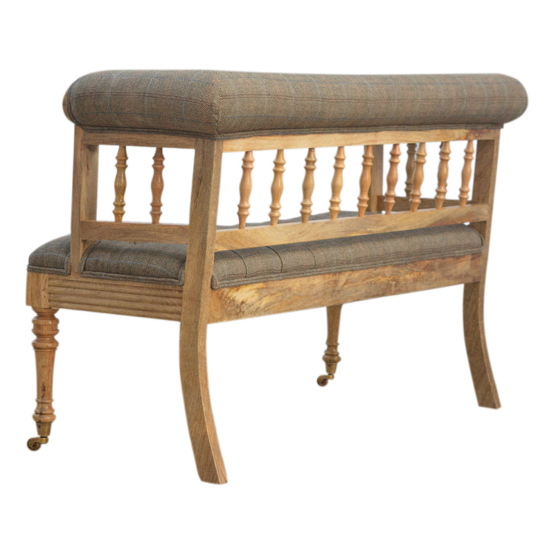 Add some luxury style to your home living area with this fabulous country tweed hallway bench. It is constructed from 100% solid mango wood in a oak-ish finish and upholstered in 100% multi tweed.  Other features include antique studs, detailed hand carved and hand turned front legs with casters and an overall oak-ish finish.