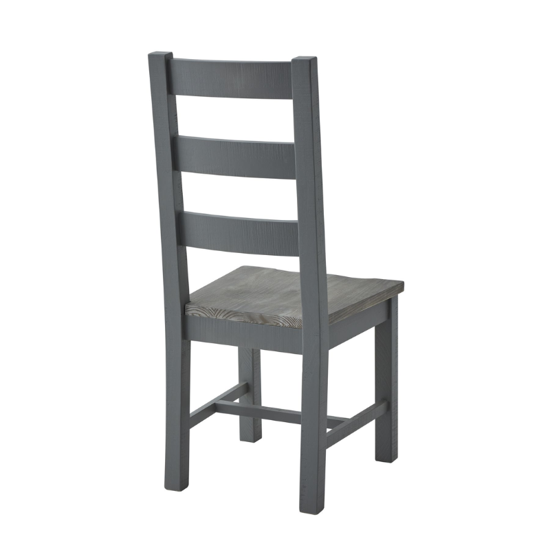 The chair's minimal design makes it a versatile addition to any dining area, whether traditional or modern. This dining chair can be paired with the matching table from the same collection to create a cohesive look in your dining space. The Oxley Collection is crafted from rough-sawn pine planks, giving each piece its unique character and worn vibe. The black cup handles add a contemporary touch to the design, while the washed pine top brings the whole look together.