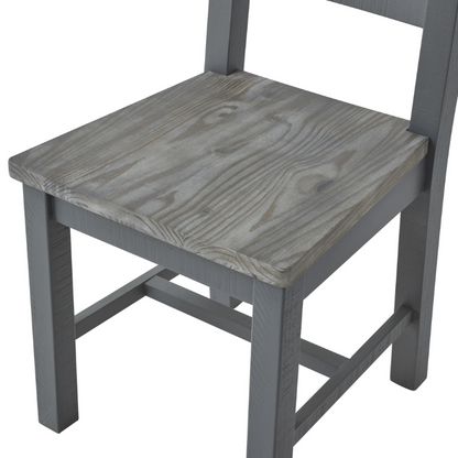 The chair's minimal design makes it a versatile addition to any dining area, whether traditional or modern. This dining chair can be paired with the matching table from the same collection to create a cohesive look in your dining space. The Oxley Collection is crafted from rough-sawn pine planks, giving each piece its unique character and worn vibe. The black cup handles add a contemporary touch to the design, while the washed pine top brings the whole look together.