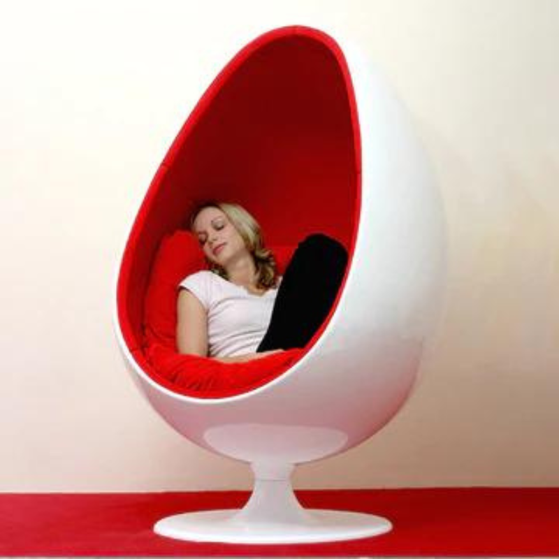 The Egg Pod Chair-Red Interior is a high-quality, retro-style chair that offers comfort and intimacy. Made of durable fiber glass material, it has a unique and unconventional design that has remained fashionable for decades. The chair features a swivel stand and a contoured seat upholstered with velvet or leather for a cozy atmosphere.