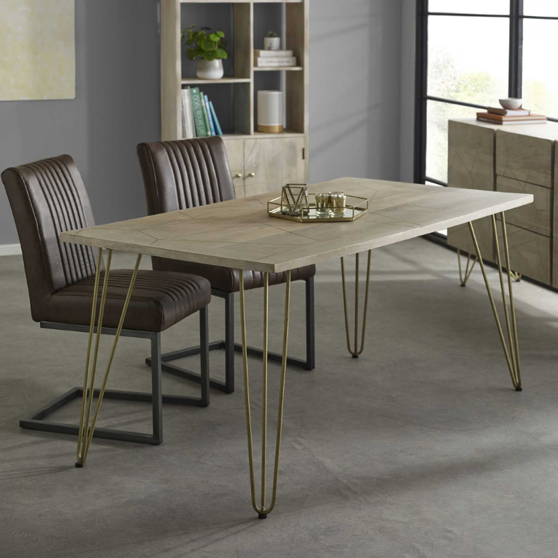 This elegant dining table is offered in a rectangular shape, it can comfortably accomodate 6 people and it is stained in a light natural finish, featuring gold metal inlays on the table top, complemented by gold metal legs.  Table top thickness: 3 cm