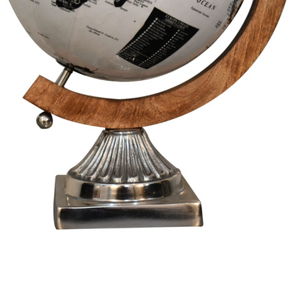 The wooden framed globe boasts a lovely white and black glossy finish. The spherical globe features loose engravings, depicting the world map. The relaxed nature and style of the design creates a striking contrast with the chrome frame.  This product is handcrafted individually and as every piece is unique please do expect variations in finish, texture, size and should not be considered as a defect.